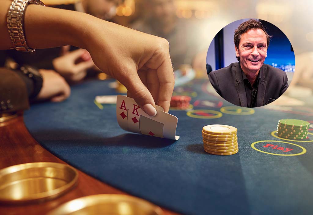 Close-up hands of a poker player checking cards on a table in a casino. Roulette game betting gambling cards poker concept.